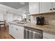Bright kitchen featuring granite countertops, stainless steel dishwasher, and white cabinets at 3550 Bay Sands Dr # 2101, Laughlin, NV 89029