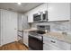 Modern kitchen with stainless steel appliances, granite countertops and clean white cabinetry at 3550 Bay Sands Dr # 2101, Laughlin, NV 89029