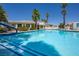 Community pool surrounded by manicured landscaping, palm trees, and inviting lounge chairs at 3550 Bay Sands Dr # 2101, Laughlin, NV 89029