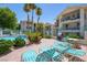Community pool area with lounge chairs, grill, and lush landscaping at 3550 Bay Sands Dr # 2101, Laughlin, NV 89029