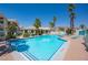 Outdoor pool showcasing clear blue water, palm trees, lounge chairs, and a well-maintained surrounding deck at 3550 Bay Sands Dr # 2101, Laughlin, NV 89029