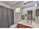 Clean bathroom featuring a vanity with sink, toilet, and shower with curtain at 3592 Gloucester Gate St, Las Vegas, NV 89122