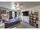 Bright bedroom with carpet, decorated with personal items, and featuring a large television at 3592 Gloucester Gate St, Las Vegas, NV 89122
