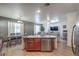 Open-concept kitchen with stainless steel appliances, adjoining dining area and living room at 3592 Gloucester Gate St, Las Vegas, NV 89122