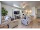 Comfortable living room with hardwood floors, a ceiling fan, and a built-in media center at 3592 Gloucester Gate St, Las Vegas, NV 89122