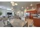 Open-concept living space with a modern kitchen, a dining area, and a comfortable living room at 3592 Gloucester Gate St, Las Vegas, NV 89122