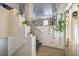 Bright foyer with staircase adorned with plants, leading to the upper level at 3592 Gloucester Gate St, Las Vegas, NV 89122