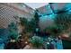 Backyard garden featuring rocks and foliage with ambient lighting at 3789 Heritage Ave, Las Vegas, NV 89121