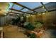 Backyard patio area with a garden bed and ambient lighting at 3789 Heritage Ave, Las Vegas, NV 89121