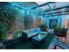 Backyard patio area with comfortable seating and ambient lighting at 3789 Heritage Ave, Las Vegas, NV 89121