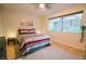Comfortable bedroom featuring a queen-size bed, side tables with lamps, and a window at 3789 Heritage Ave, Las Vegas, NV 89121