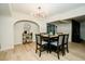 Inviting dining room with a modern table set for eight, elegant lighting, and stylish decor at 3789 Heritage Ave, Las Vegas, NV 89121