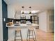 A well-lit kitchen featuring white cabinets and stainless steel appliances at 3789 Heritage Ave, Las Vegas, NV 89121