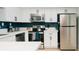 Bright kitchen featuring white cabinetry, stainless steel appliances, and a kitchen island at 3789 Heritage Ave, Las Vegas, NV 89121