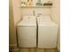 Laundry room with a washer, dryer, and shelving at 3789 Heritage Ave, Las Vegas, NV 89121