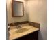 Bathroom featuring stone tile accents and a wood-framed vanity at 4016 Edgeford Pl, Las Vegas, NV 89102