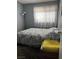 Bedroom with plushy carpet and soft natural light at 4016 Edgeford Pl, Las Vegas, NV 89102