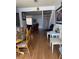 Dining area with laminate floors and access to stairs at 4016 Edgeford Pl, Las Vegas, NV 89102