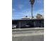 Exterior shot with garages and cars parked outside on a sunny day at 4016 Edgeford Pl, Las Vegas, NV 89102