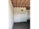 A vacant, single-car garage with a white door offers parking or storage at 4016 Edgeford Pl, Las Vegas, NV 89102