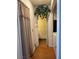 A hallway with light-colored wood floors leads towards an open area at 4016 Edgeford Pl, Las Vegas, NV 89102