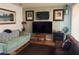 Cozy living room featuring comfortable sofas and a modern entertainment center at 4016 Edgeford Pl, Las Vegas, NV 89102