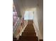 Staircase featuring wooden steps and white guardrail at 4016 Edgeford Pl, Las Vegas, NV 89102