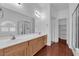 Bathroom with a large mirror, double vanity, and a glass-enclosed shower at 4029 Ricebird Way, North Las Vegas, NV 89084