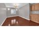 Serene bedroom with a chandelier, hardwood floors, and built-in cabinets at 4029 Ricebird Way, North Las Vegas, NV 89084