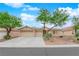 Charming single-story home featuring a three-car garage and desert landscaping at 4029 Ricebird Way, North Las Vegas, NV 89084
