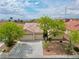 Charming home with a three-car garage and well-maintained landscaping in a residential neighborhood at 4029 Ricebird Way, North Las Vegas, NV 89084