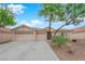 Charming single-story home featuring a three-car garage and desert landscaping at 4029 Ricebird Way, North Las Vegas, NV 89084