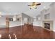 Spacious living room with hardwood floors and a seamless transition to the kitchen at 4029 Ricebird Way, North Las Vegas, NV 89084