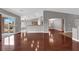 Spacious living room with hardwood floors and a seamless transition to the kitchen at 4029 Ricebird Way, North Las Vegas, NV 89084