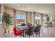 Stylish dining room with modern furniture and sliding doors leading to an outdoor area at 4445 Bayley Skye Ave # 106, Las Vegas, NV 89141