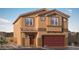 Charming two-story home with a tile roof, two-car garage, and desert landscaping at 4445 Bayley Skye Ave # 106, Las Vegas, NV 89141