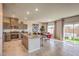Open concept kitchen with stainless steel appliances, granite countertops and a large island at 4445 Bayley Skye Ave # 106, Las Vegas, NV 89141