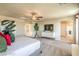 Bright main bedroom featuring a ceiling fan, ensuite bathroom and plenty of natural light at 4445 Bayley Skye Ave # 106, Las Vegas, NV 89141