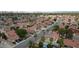 This is an aerial view of a neighborhood with many houses and tree lined streets in the city at 4732 Illustrious St, Las Vegas, NV 89147