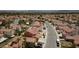 Aerial view of a residential street with houses and tree lined streets in the city at 4732 Illustrious St, Las Vegas, NV 89147