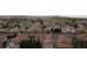 Expansive aerial view of a neighborhood with many houses and tree lined streets at 4732 Illustrious St, Las Vegas, NV 89147
