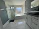 Contemporary bathroom featuring a glass shower, soaking tub, and stylish vanity at 4732 Illustrious St, Las Vegas, NV 89147
