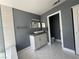 Modern bathroom with double mirrors, vessel sink and white marble-style floor at 4732 Illustrious St, Las Vegas, NV 89147