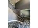 Grand entryway featuring a winding staircase, grey walls, and marble floors at 4732 Illustrious St, Las Vegas, NV 89147