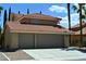 Two story home featuring a terracotta-tiled roof and a two-car garage at 4732 Illustrious St, Las Vegas, NV 89147