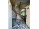 Elegant foyer showcases a staircase with iron railing and distinctive marble flooring, welcoming guests into the home at 4732 Illustrious St, Las Vegas, NV 89147