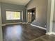 Bright living room with wood floors, neutral colors, and natural light at 4732 Illustrious St, Las Vegas, NV 89147