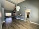 Open-concept living room featuring hardwood floors, a modern chandelier, and recessed lighting at 4732 Illustrious St, Las Vegas, NV 89147
