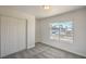 Cozy bedroom featuring a double door closet, neutral paint, and bright window at 4889 W Montara Cir, Las Vegas, NV 89121