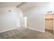 Spacious bedroom with vaulted ceilings, carpet floors, and multiple doors for convenience at 4889 W Montara Cir, Las Vegas, NV 89121